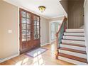 Welcoming foyer with hardwood floors and staircase at 4335 Halifax Ne Ter, Roswell, GA 30075