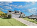 Beautiful single-Gathering home with attached garage and well-maintained lawn at 302 Canter Way, Woodstock, GA 30188