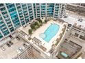Enjoy a relaxing rooftop pool and lounge area with pergolas at this luxury high rise condo at 400 W Peachtree Nw St # 1408, Atlanta, GA 30308