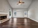 Spacious living room featuring wood floors and large windows providing natural light at 255 Pine Valley Dr, Powder Springs, GA 30127