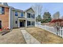 Charming two-story home with a well-manicured lawn and inviting front porch and attractive architectural details at 1284 Warsaw Rd, Roswell, GA 30076