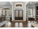Grand entrance foyer featuring hardwood floors, large windows, and stylish decor at 5222 N Helton Rd, Winston, GA 30187