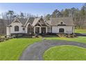Stunning home with a circular driveway and expertly manicured lawn at 5222 N Helton Rd, Winston, GA 30187