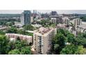 Aerial view of the condo and surrounding area with skyline view in the background at 1 Biscayne Nw Dr # 706, Atlanta, GA 30309
