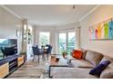 Cozy living room with hardwood floors, lots of natural light, and dining area at 1 Biscayne Nw Dr # 706, Atlanta, GA 30309