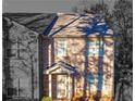 Charming two-story brick home with a cozy front porch and well-maintained landscaping at 3462 Mount Zion Rd, Stockbridge, GA 30281