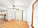 Bright dining room featuring hardwood floors, ceiling fan, and sliding door to back at 3276 Pin Oak Cir, Doraville, GA 30340