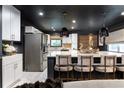 Stylish kitchen with an island with seating and stainless steel appliances at 1388 Willow Sw Trl, Atlanta, GA 30311