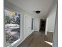 Inviting foyer with large windows, a wood door, vinyl flooring, and ample natural light at 3825 Emerson St, Marietta, GA 30062