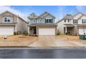 Charming two-story home featuring a brick facade, attached two-car garage, and a well-manicured front yard at 5915 Pinnacle View Rd, Cumming, GA 30040