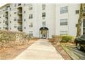 The Lenox Villas main entrance with a covered walkway, showcasing accessibility and design at 970 Sidney Marcus Ne Blvd # 1208, Atlanta, GA 30324