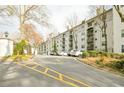 Exterior view of Lenox Villas with well-maintained landscaping and ample parking for residents and guests at 970 Sidney Marcus Ne Blvd # 1208, Atlanta, GA 30324