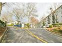 Driveway view leading to the Lenox Villas apartments, showcasing the building's exterior and landscaping at 970 Sidney Marcus Ne Blvd # 1208, Atlanta, GA 30324