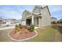 Charming two-story home with a covered porch and manicured lawn at 2551 Bear Mountain St, Lithonia, GA 30058