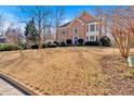 Expansive front yard showcases a two-story brick home with classic architectural details at 3699 Fowler Rdg, Douglasville, GA 30135