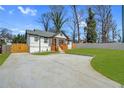 Beautiful craftsman-style home featuring new concrete driveway, well-manicured lawn, and stylish exterior at 3470 Glenwood Rd, Decatur, GA 30032