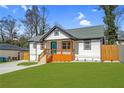 Attractive craftsman-style home showcasing a vibrant lawn, modern siding, and a welcoming porch at 3470 Glenwood Rd, Decatur, GA 30032