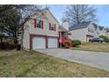Lovely two-story home with brick facade, attached 2-car garage, and well-kept lawn at 4096 Mistymorn Ln, Powder Springs, GA 30127