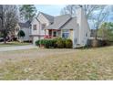 Charming two-story home with a two-car garage and inviting red porch steps at 4096 Mistymorn Ln, Powder Springs, GA 30127