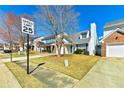 Attractive home with brick and siding exterior, complemented by a well-manicured lawn and a clear blue sky backdrop at 4105 Ravenwood Ct # 3, Union City, GA 30291