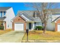 Inviting two-story home with brick accents, single-car garage, and a neatly kept lawn, perfect for suburban living at 4105 Ravenwood Ct # 3, Union City, GA 30291