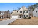 Charming two-story home featuring stone accents, neutral siding, and an attached two-car garage at 461 Charleston Pl, Villa Rica, GA 30180