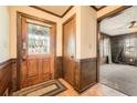 Inviting entryway features a decorative glass door and wood accents that leads to a spacious living area at 4722 Bexley Dr, Stone Mountain, GA 30083