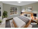 Cozy bedroom with large window and stylish decor at 521 Country Lake Dr, Mcdonough, GA 30252