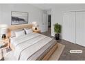 Comfortable bedroom with neutral tones, carpet flooring, and double door closet at 212 Riverstone Commons Cir, Canton, GA 30114