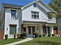 Charming two-story home with a landscaped yard and decorative accents at 2173 Montrose Sw Ave, Atlanta, GA 30311