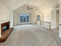 Bright living room featuring a fireplace and vaulted ceilings at 4905 Ascot Nw Blf, Acworth, GA 30102