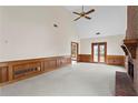 Large living room with a brick fireplace, high ceilings, wood trim, and access to the outdoors at 10625 Haynes Forest Dr, Alpharetta, GA 30022