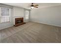 A spacious living room featuring a fireplace and large windows, ready for personalization and comfort at 2208 Howell Farms Nw Pt, Acworth, GA 30101