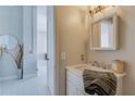 Modern bathroom featuring a vanity sink, stylish mirror, and contemporary finishes at 20 Marietta Nw St # 15D, Atlanta, GA 30303