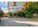 Inviting building entrance with covered canopy and well-manicured landscaping at 2626 at 2626 Peachtree Nw Rd # 206, Atlanta, GA 30305