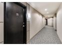 Well lit condo hallway with decorative carpet and unit 206 clearly labeled at 2626 Peachtree Nw Rd # 206, Atlanta, GA 30305