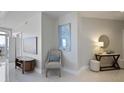 Neutral hallway with seating area, artwork, and a console table, leading to the balcony at 325 E Paces Ferry Ne Rd # 2005, Atlanta, GA 30305