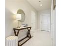 Inviting hallway with tile floors, stylish console table, and contemporary decor at 325 E Paces Ferry Ne Rd # 2005, Atlanta, GA 30305