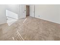 This bedroom features neutral carpet, white walls, and an open doorway at 5025 Skipping Stone Ct, Cumming, GA 30028