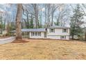 Inviting split-level home showcasing a freshly painted exterior and covered carport at 8483 Magnolia Dr, Jonesboro, GA 30238