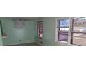 Bright living room featuring fresh mint paint, and natural light from multiple windows at 6258 Mount Zion Blvd, Morrow, GA 30260