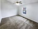 Bright bedroom with a ceiling fan, window, and ample space at 6420 Wedgeview Dr, Tucker, GA 30084