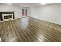 Spacious living room boasts sleek wood floors and natural light from the back door at 6420 Wedgeview Dr, Tucker, GA 30084