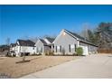 Well maintained home exterior with manicured lawn and a driveway leading to an attached garage at 165 Ruby Ln, Mcdonough, GA 30252