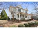 Side view of a charming two-story home with a well-manicured lawn and mature trees at 3137 Primrose St, Douglasville, GA 30135