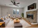Cozy living room featuring a stone fireplace, neutral decor, ceiling fan, and ample natural light at 51 Lost Meadows Dr, Dallas, GA 30157