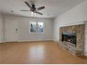 Bright living room featuring a stone fireplace and sleek, hard-surface flooring at 51 Lost Meadows Dr, Dallas, GA 30157