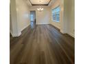 Bright dining room with hardwood floors, neutral walls, and a chandelier under trey ceiling at 5928 Cobblestone Creek Cir, Mableton, GA 30126
