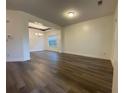 Spacious dining room featuring hardwood floors, neutral walls, and a decorative chandelier at 5928 Cobblestone Creek Cir, Mableton, GA 30126