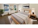 Calm main bedroom featuring neutral color palette, many windows, and stylish decor at 1181 Paramount Dr, Mcdonough, GA 30253